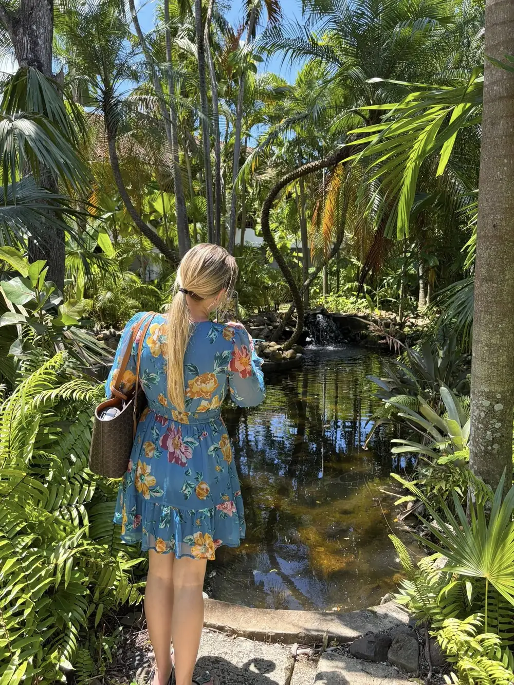 Rachel exploring a tropical jungle garden in Latin America